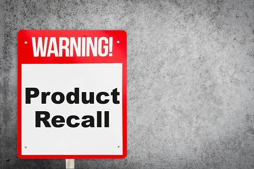 Red and white warning sign with grey background saying 22Warning! Product Recall22.jpg