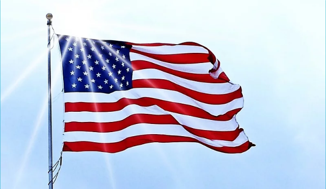 Sun shining over the American flag